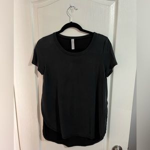 Woman’s M boutique medium black shirt with slit in sides